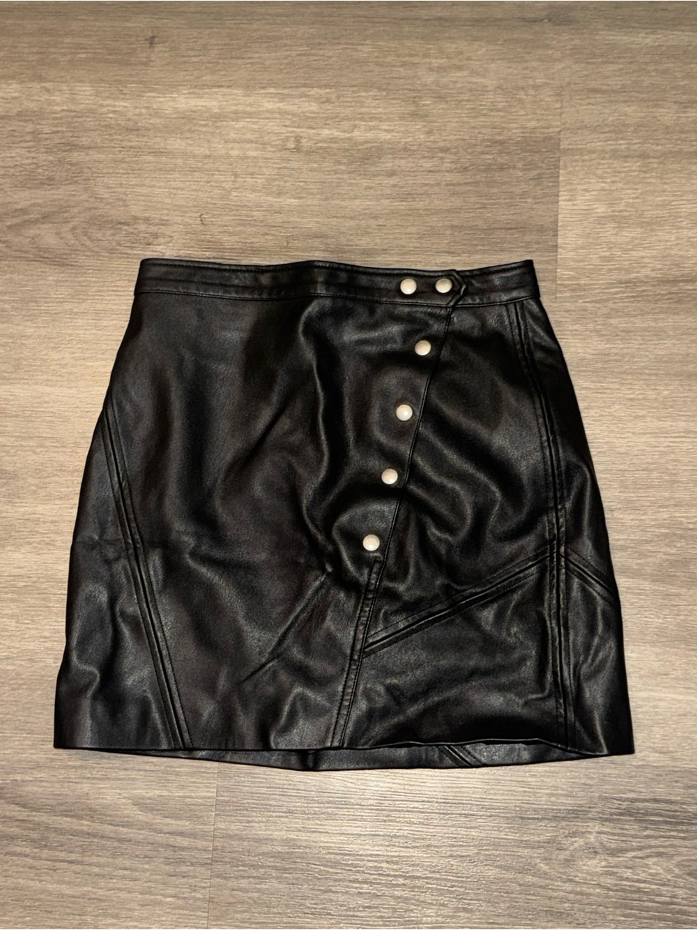 Blank NYC Black Faux Leather Mini Skirt with Diagonal Snap Panel